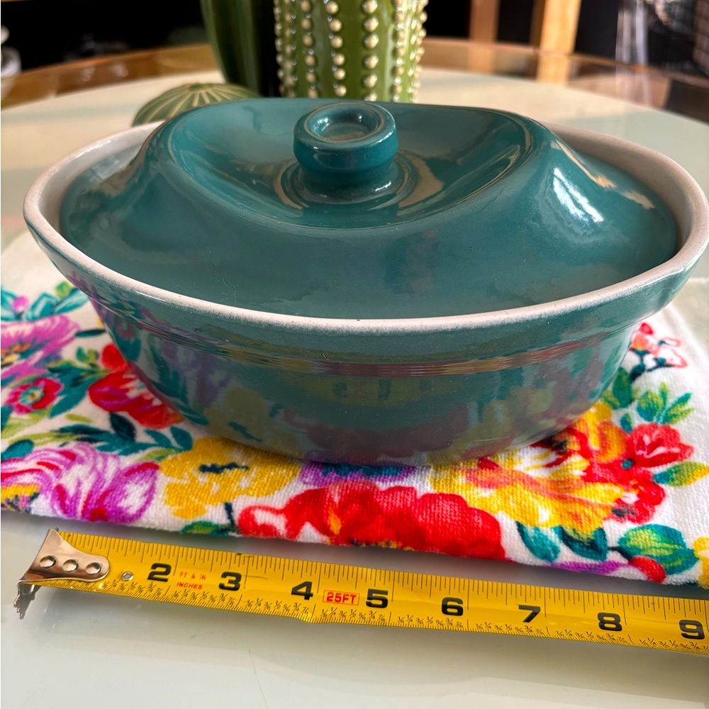 Teal casserole dish with lid.